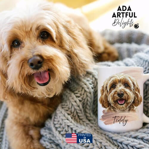 A fluffy golden Labradoodle dog sitting next to its custom-printed portrait mug labeled Teddy.